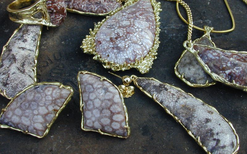Antiguanite pendants and earrings set in gold